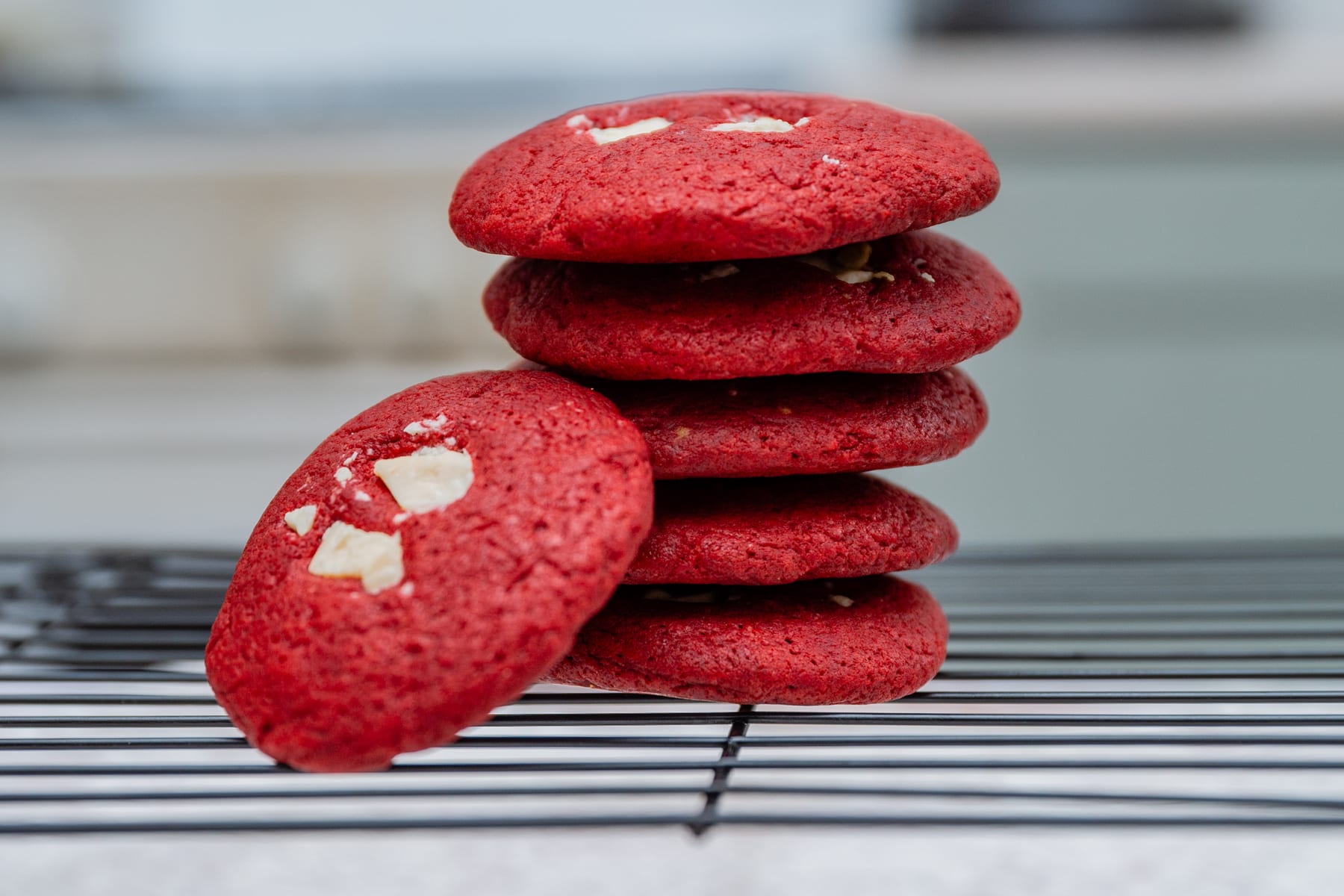 Stack of The Red Queen red velvet cookies with white chocolate chunks